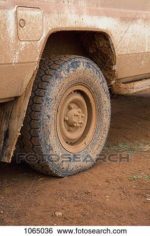 Muddy tire on a truck View Large Photo Image Stock Photograph - Muddy tire on a truck. Fotosearch