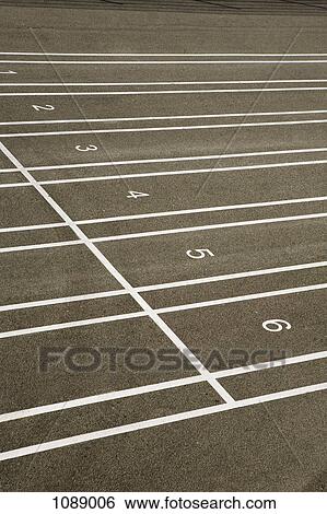 Stock Photograph - Numbered lanes on a track field. Fotosearch