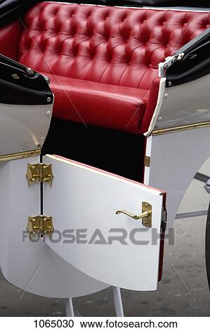 Stock Image - Open door of a horse drawn carriage. Fotosearch