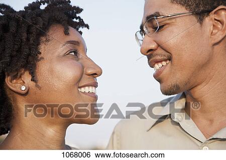 Portrait of a couple face to face View Large Photo Image Stock Photograph - Portrait of a couple face to face. Fotosearch