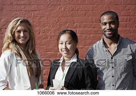 Stock Photograph - Portrait of three colleagues. Fotosearch