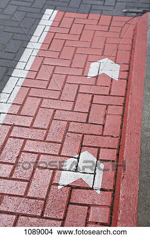 Road markings on a cobblestone road View Large Photo Image Picture - Road markings on a cobblestone road. Fotosearch