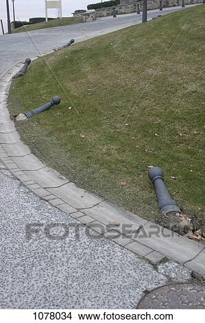 Roadside bollards knocked over View Large Photo Image Picture - Roadside bollards knocked over. Fotosearch