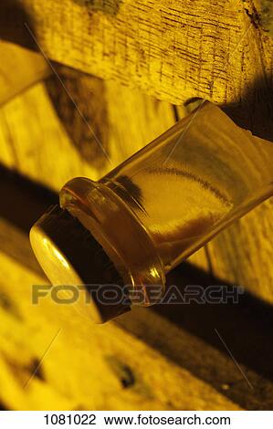 Sediment in champagne bottle in cellar View Large Photo Image Stock Image - Sediment in champagne bottle in cellar. Fotosearch