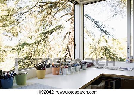 Small office with pots of assorted pens and pencils View Large Photo Image Stock Image - Small office with pots of assorted pens and pencils. Fotosearch
