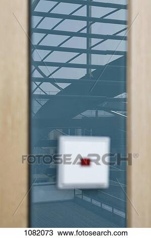 Staircase reflected on glass wall with blurred light switch in foreground View Large Photo Image Stock Image - Staircase reflected on glass wall with blurred light switch in foreground. Fotosearch