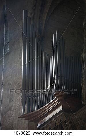 Stock Image - The pipes of a pipe organ in a church. Fotosearch