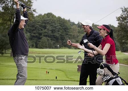 Three ecstatic golfers celebrating a win View Large Photo Image Stock Photo - Three ecstatic golfers celebrating a win. Fotosearch