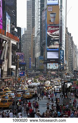 Stock Image - Times Square in New York, crowded with people and traffic. Fotosearch