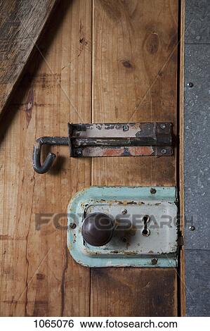 Two old-fashioned locks on a wooden door View Large Photo Image Stock Photograph - Two old-fashioned locks on a wooden door. Fotosearch