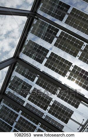 Under a row of solar panels on an open roof with sky in background View Large Photo Image Stock Image - Under a row of solar panels on an open roof with sky in background. Fotosearch