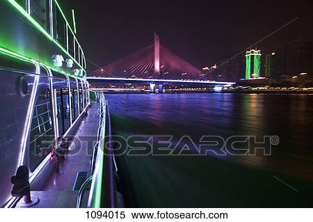 Yacht on Pearl River in Hong Kong and illuminated Haiyin Bridge in background View Large Photo Image Stock Photography - Yacht on Pearl River in Hong Kong and illuminated Haiyin Bridge in background. Fotosearch