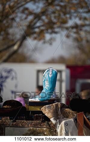 A blue cowboy boot at a flea market View Large Photo Image Stock Image - A blue cowboy boot at a flea market. Fotosearch