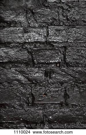 Picture - A brick wall painted black, full frame. Fotosearch