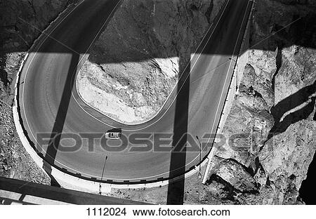 A car on a two lane highway, high angle view View Large Photo Image Picture - A car on a two lane highway, high angle view. Fotosearch