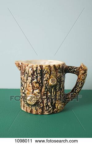 A ceramic creamer made to look like tree bark View Large Photo Image Stock Image - A ceramic creamer made to look like tree bark. Fotosearch