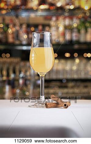 A cocktail on a table View Large Photo Image Stock Photo - A cocktail on a table. Fotosearch