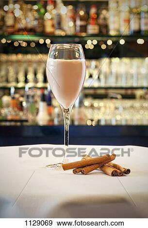 A cocktail on a table View Large Photo Image Stock Photo - A cocktail on a table. Fotosearch