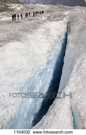 A crevasse in the Aletsch Glacier, Switzerland, hikers in background View Large Photo Image Stock Image - A crevasse in the Aletsch Glacier, Switzerland, hikers in background. Fotosearch