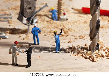 A diorama of a miniature construction site, foreman shaking hands with businessman View Large Photo Image Stock Image - A diorama of a miniature construction site, foreman shaking hands with businessman. Fotosearch