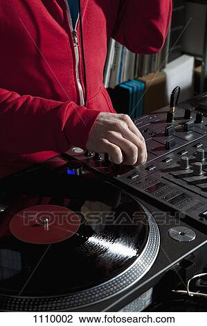 A DJ adjusting a knob on a sound mixer, detail of hands View Large Photo Image Stock Image - A DJ adjusting a knob on a sound mixer, detail of hands. Fotosearch