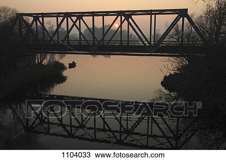 A fisherman at sunrise, Lake Havel, Brandenburg, Germany View Large Photo Image Stock Image - A fisherman at sunrise, Lake Havel, Brandenburg, Germany. Fotosearch