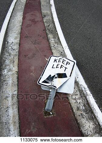 A flattened Keep Left road sign View Large Photo Image Stock Photography - A flattened Keep Left road sign. Fotosearch