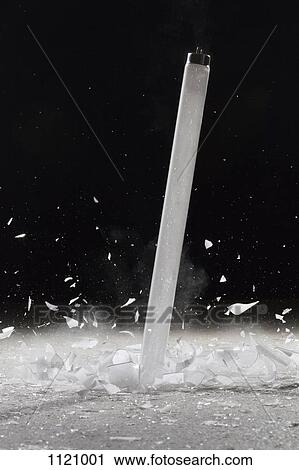Stock Image - A fluorescent tube shattering. Fotosearch
