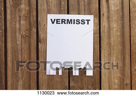A flyer posted on a wooden fence with the German word for missing on it View Large Photo Image Stock Image - A flyer posted on a wooden fence with the German word for missing on it. Fotosearch