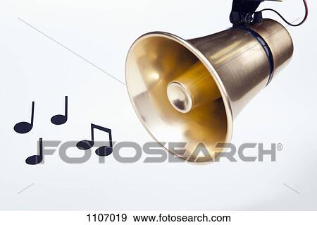 A gold loudspeaker hanging next to musical notes View Large Photo Image Stock Photo - A gold loudspeaker hanging next to musical notes. Fotosearch