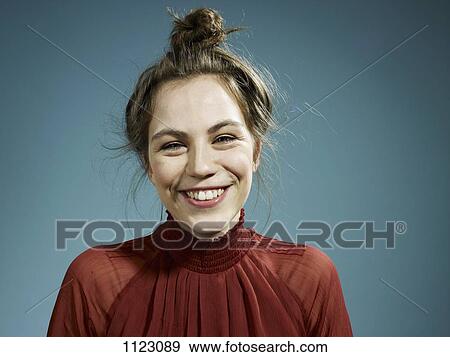 A happy hip young woman smiling at the camera View Large Photo Image Stock Photo - A happy hip young woman smiling at the camera. Fotosearch