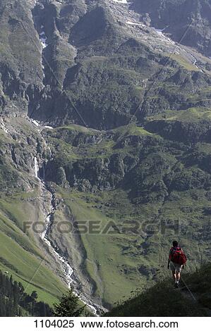 A hiker on a trail, Breithorn Mountain, Switzerland View Large Photo Image Stock Photography - A hiker on a trail, Breithorn Mountain, Switzerland. Fotosearch