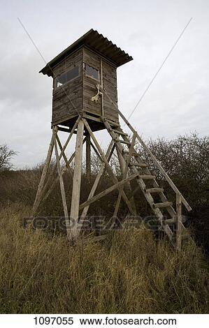 Stock Photography - A hunting tower in a field. Fotosearch