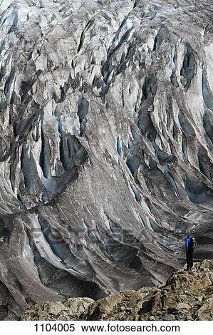 A man looking at the Aletsch Glacier, Valais Canton, Switzerland View Large Photo Image Stock Photography - A man looking at the Aletsch Glacier, Valais Canton, Switzerland. Fotosearch