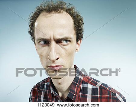 A man looking suspiciously to the side View Large Photo Image Stock Photo - A man looking suspiciously to the side. Fotosearch
