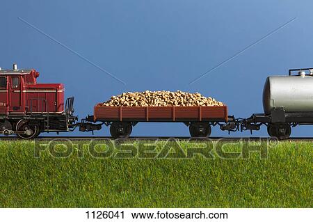 A miniature toy freight train View Large Photo Image Stock Image - A miniature toy freight train. Fotosearch