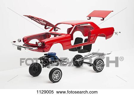 A model car taking a part, some pieces in mid-air View Large Photo Image Stock Photography - A model car taking a part, some pieces in mid-air. Fotosearch
