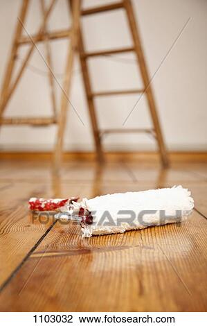 A paint roller on a hardwood floor, ladder in background View Large Photo Image Stock Image - A paint roller on a hardwood floor, ladder in background. Fotosearch