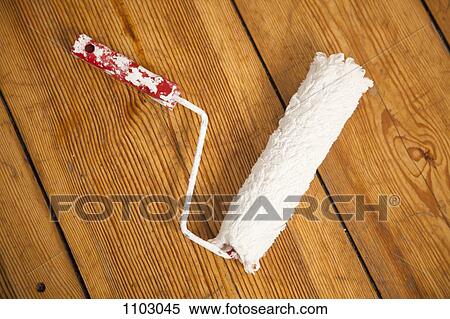 A paint roller on a hardwood floor, directly above View Large Photo Image Stock Photography - A paint roller on a hardwood floor, directly above. Fotosearch