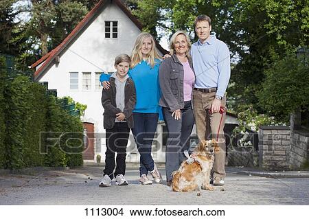 Picture - A portrait of a family of four and their dog. Fotosearch