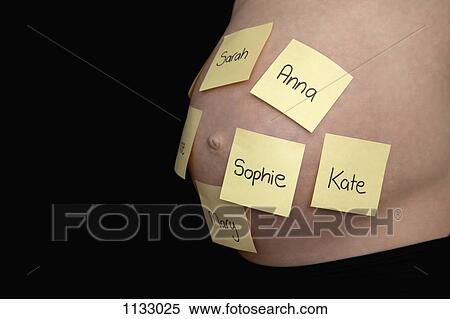 A pregnant woman's belly with different first names written on sticky notes View Large Photo Image Stock Photography - A pregnant woman's belly with different first names written on sticky notes . Fotosearch