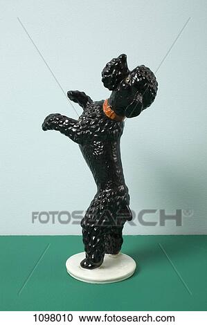 A retro dog figurine begging on its hind legs View Large Photo Image Stock Image - A retro dog figurine begging on its hind legs. Fotosearch