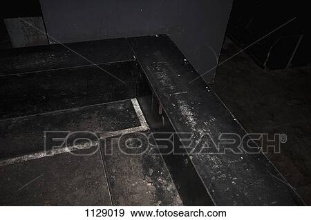 Stock Photo - A room corner with a worn built in bench against the wall. Fotosearch