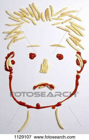 A sad face made from french fries and ketchup View Large Photo Image Stock Photo - A sad face made from french fries and ketchup. Fotosearch