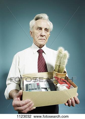 A senior man carrying a box of possessions after being fired View Large Photo Image Stock Image - A senior man carrying a box of possessions after being fired. Fotosearch