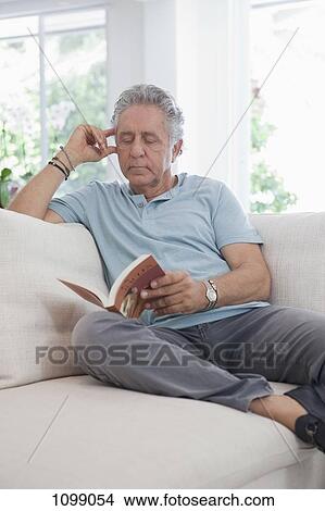 A senior man reading a book View Large Photo Image Picture - A senior man reading a book. Fotosearch