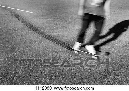 A skateboarder leaving tire tracks View Large Photo Image Stock Image - A skateboarder leaving tire tracks. Fotosearch