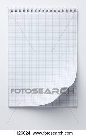 stock photo of a spiral notepad with graph paper and a curled up graph paper notepad
