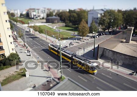 Stock Photo - A street scene with a tram, tilt-shift, Berlin, Germany. Fotosearch