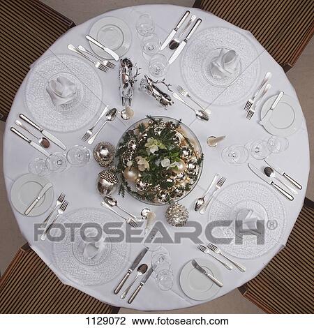 A table set for a formal dinner for four View Large Photo Image Stock Image - A table set for a formal dinner for four. Fotosearch
